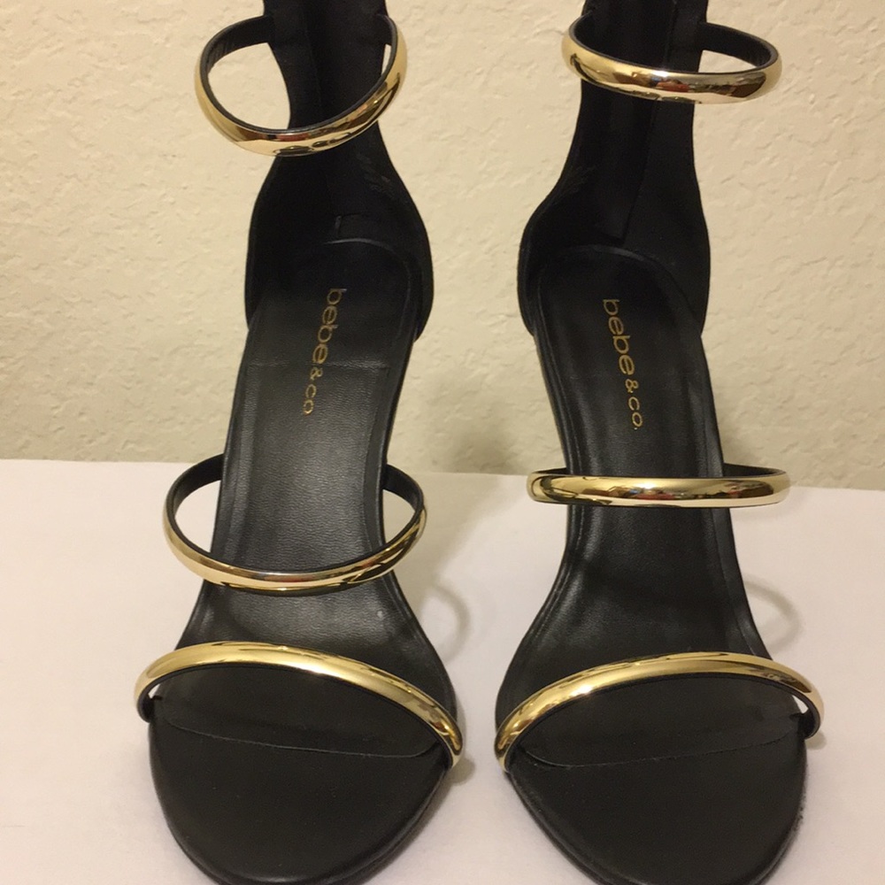 Classy Black/Gold Bebe high heels.